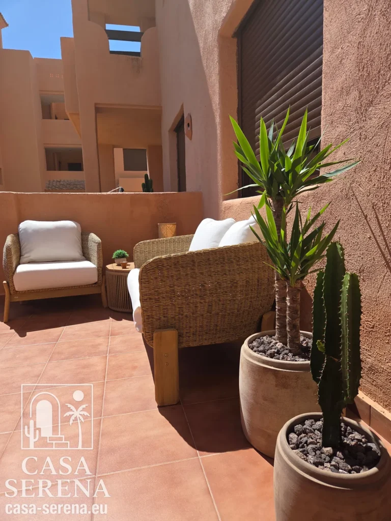 Ibiza-style lounge corner on the private terrace of Casa Serena holiday apartment in Los Alcázares, Spain.
